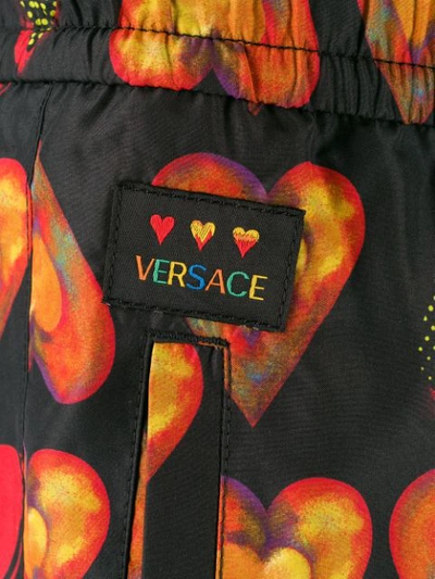 Shop Versace Watercolor Hearts Joggers In Black