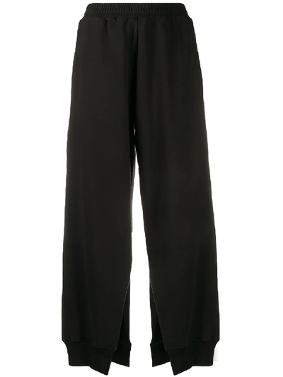 Shop Mm6 Maison Margiela Slit Wide-leg Trousers In Black