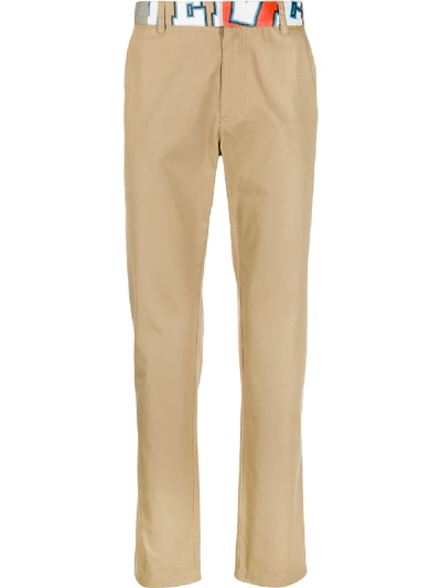 Shop Versace Abstract Logo Print Slim Trousers In Neutrals