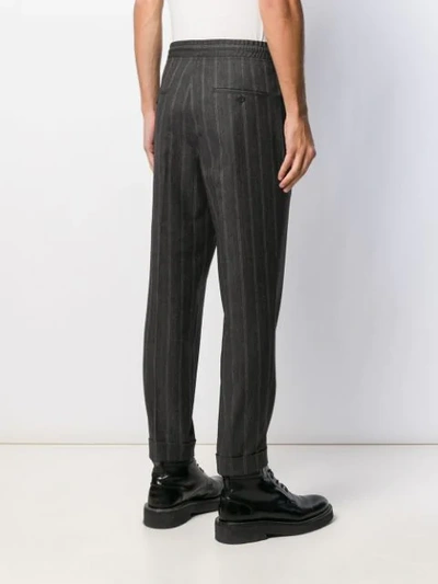 Shop Neil Barrett Striped Tapered Trousers In Grey