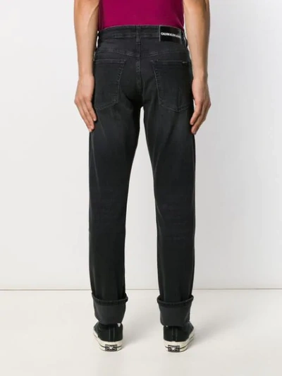 Shop Calvin Klein Jeans Est.1978 Ripped Detail Jeans In Black