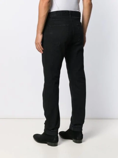 Shop Saint Laurent Straight-leg Trousers - Black