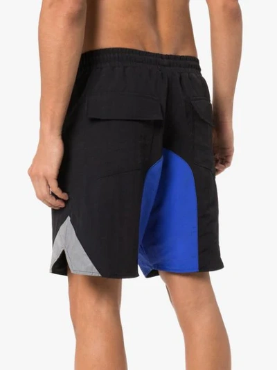 Shop Rhude Logo Print Swim Shorts In Black