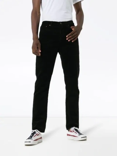 Shop Saint Laurent Mid-rise Cord Trousers - Black