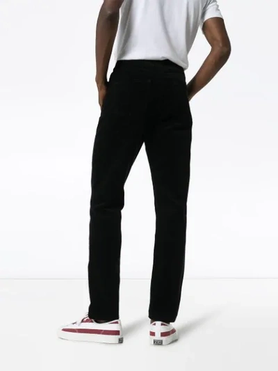 Shop Saint Laurent Mid-rise Cord Trousers - Black