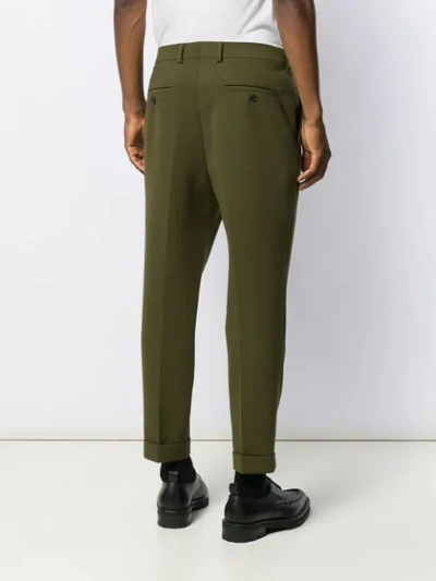 Shop Ami Alexandre Mattiussi Carrot Fit Pleated Trousers In Green