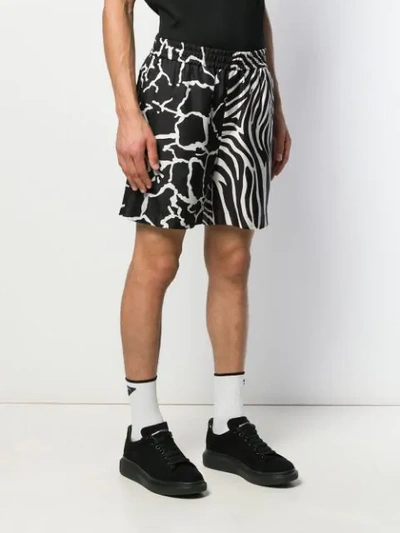 Shop Versace Animal Print Shorts In Black