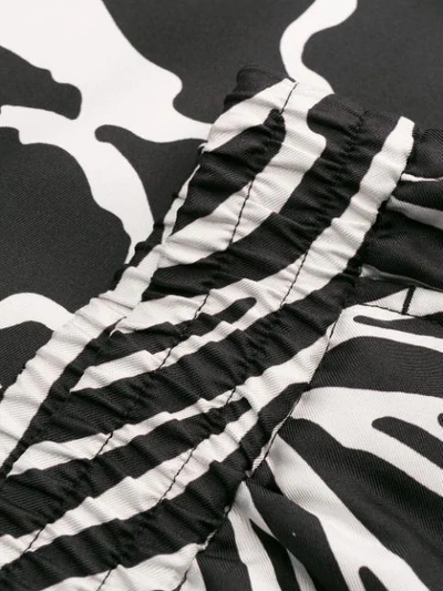 Shop Versace Animal Print Shorts In Black