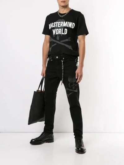 Shop Mastermind Japan Skull Print Trousers In Black