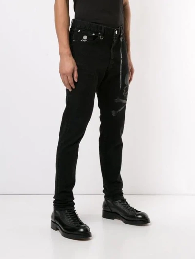 Shop Mastermind Japan Skull Print Trousers In Black