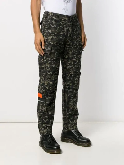 Shop Not Guilty Homme Camouflage Print Trousers In Green