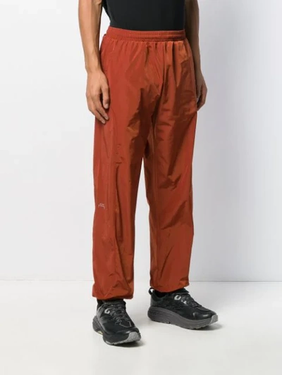 Shop A-cold-wall* Overlock Nylon Track Pants In Orange