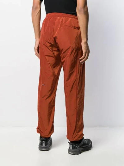 Shop A-cold-wall* Overlock Nylon Track Pants In Orange