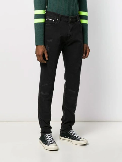 Shop Represent Low Rise Slim Fit Jeans In Black