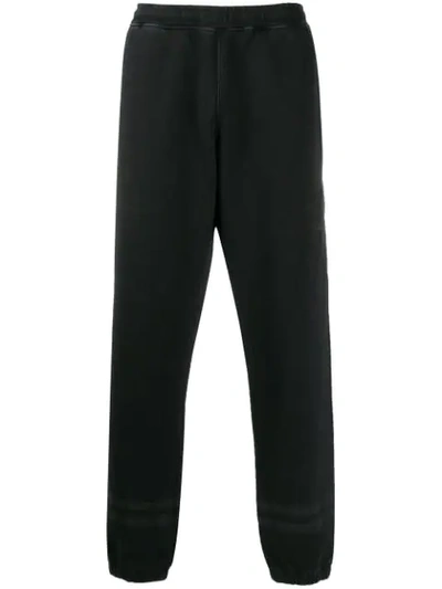 Shop Stone Island Embroidered Track Pants In Black