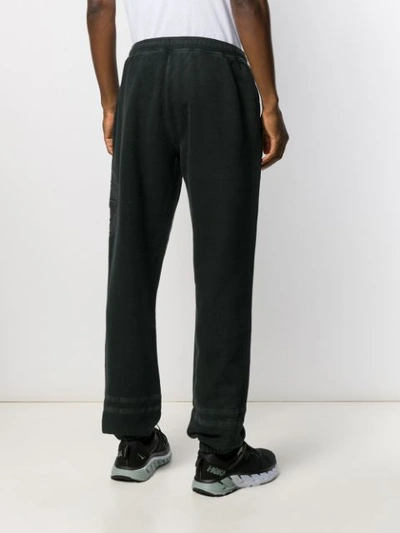 Shop Stone Island Embroidered Track Pants In Black