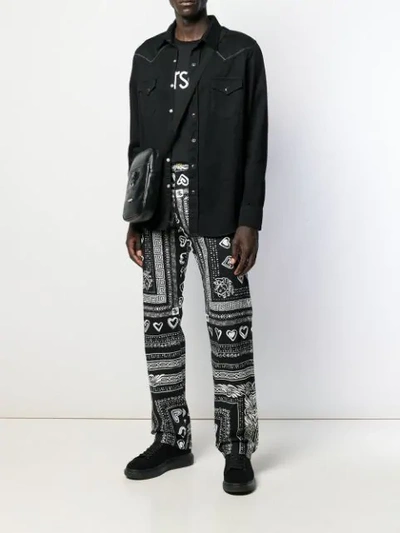 Shop Versace Bandana Print Wide-leg Jeans In Black