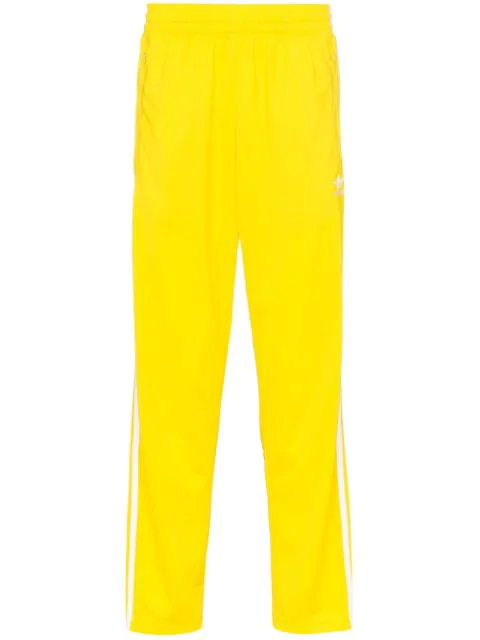 yellow adidas trousers