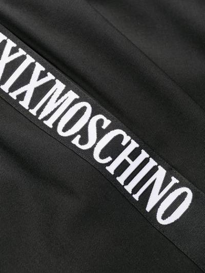 Shop Moschino Logo Trim Track Pants In Black