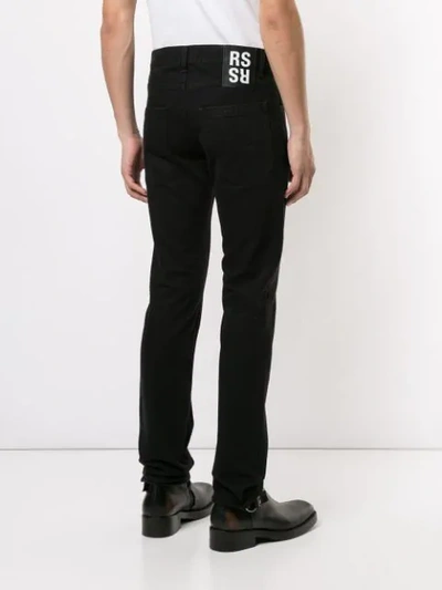 Shop Raf Simons Slim-fit Logo Patch Jeans In Black