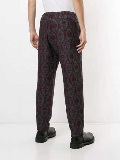 Shop Undercover X Valentino Loose Fit Trousers In Red