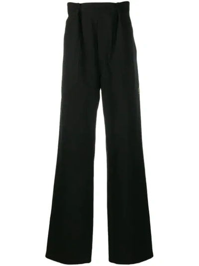 Shop Raf Simons Pleated Flared Trousers In Black