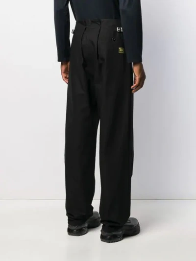Shop Raf Simons Pleated Flared Trousers In Black