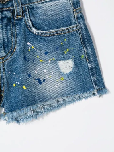 Shop Msgm Splash Print Denim Shorts In Blue