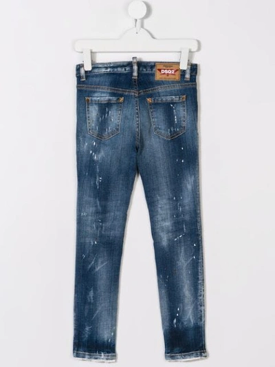 Shop Dsquared2 Paint Splattered Jeans In Blue