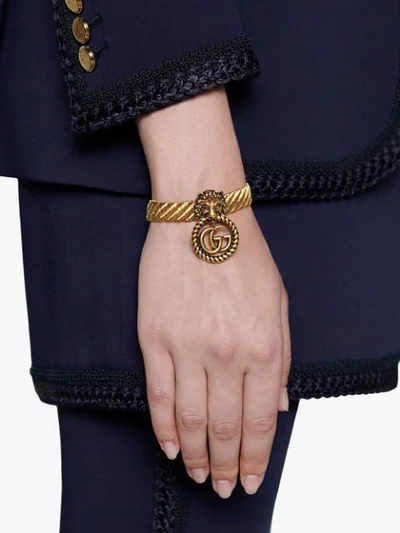Shop Gucci Lion Head Bracelet In Gold
