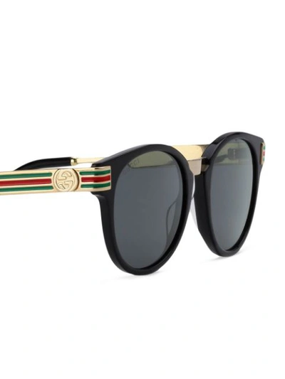 Shop Gucci Round Frame Sunglasses In Black