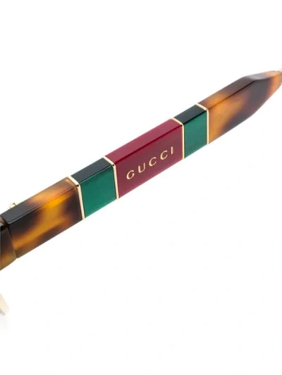 Gucci Tortoiseshell Effect Sunglasses In Gold