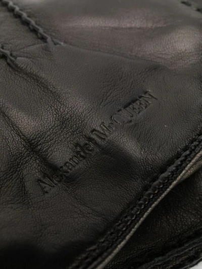 Shop Alexander Mcqueen Logo Embossed Gloves In Black