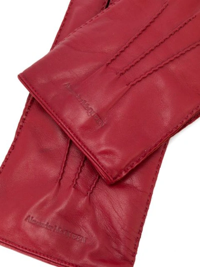 Shop Alexander Mcqueen Logo Embossed Gloves In Red