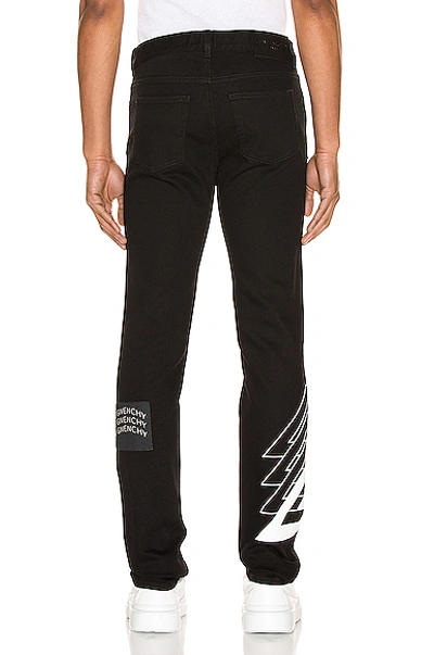 Shop Givenchy Patch Jeans In Black