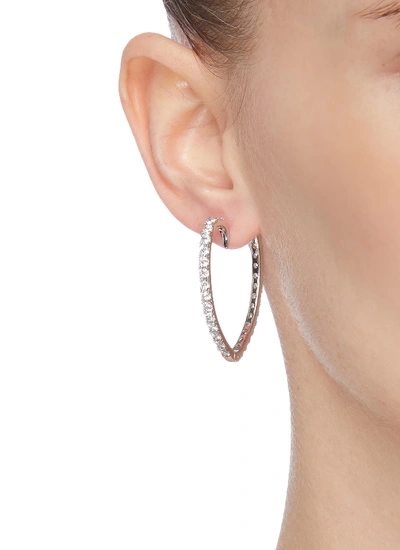 Shop Cz By Kenneth Jay Lane Heart Shaped Embellished Hoop Earrings In Metallic