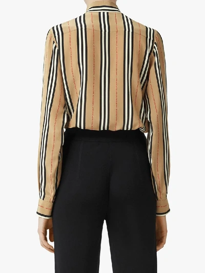 Shop Burberry Icon Stripe Pussy-bow Blouse In Neutrals