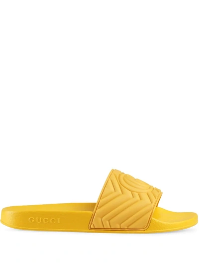 Shop Gucci Men's Matelassé Rubber Slides In Yellow