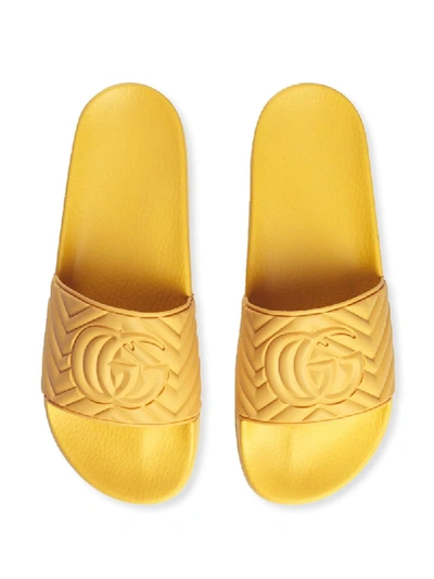 Shop Gucci Men's Matelassé Rubber Slides In Yellow