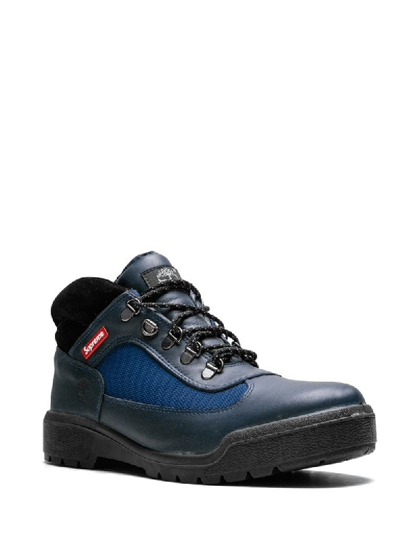 blue and red timberland field boots