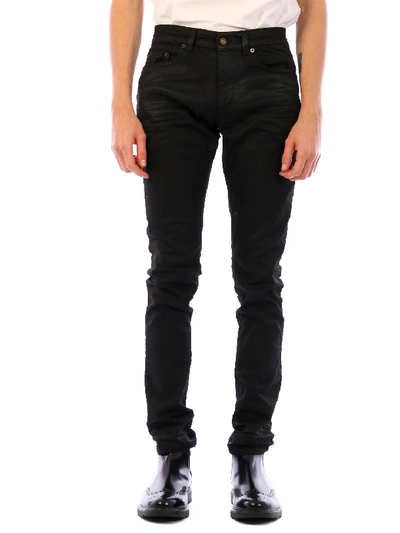 Shop Saint Laurent Coated Skinny Denim Pants In Black