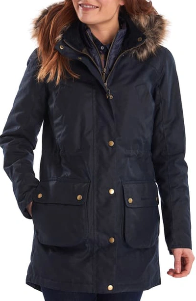Shop Barbour Thrunton Waxed Cotton Jacket With Faux Fur Trim In Navy/ Classic
