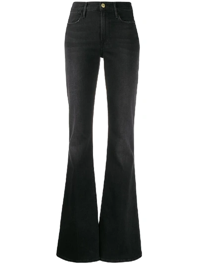 Shop Frame High-waisted Flared Jeans In Black