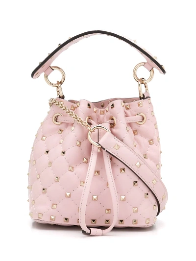 Shop Valentino Garavani Small Rockstud Spike Bucket Bag In Pink