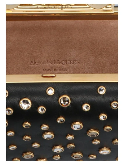 Shop Alexander Mcqueen Four Ring Crystal Embellished Clutch In Black