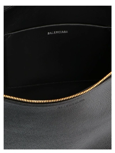 Shop Balenciaga Logo Printed Clutch Bag In Black