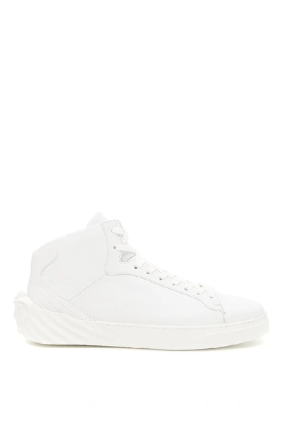 Shop Versace Leather Hi Top Sneakers In White