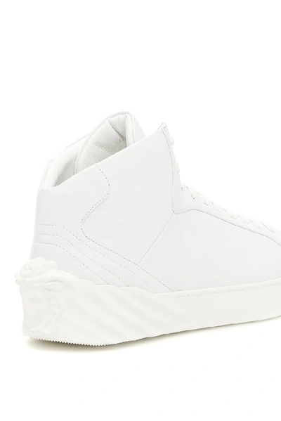 Shop Versace Leather Hi Top Sneakers In White
