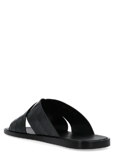 Shop Balenciaga Embossed Crossover Slides In Black