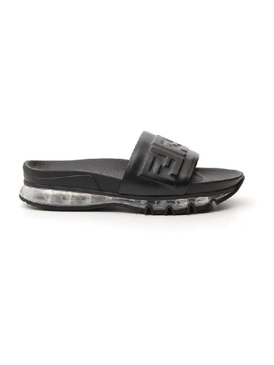 Shop Fendi Ff Monogram Embossed Slides In Black